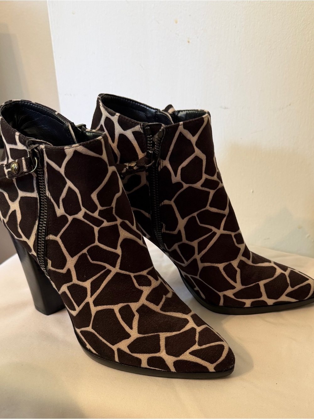 Stuart Weitzman Giraffe-Print Pointed Toe Ankle Booties in Black and Tan